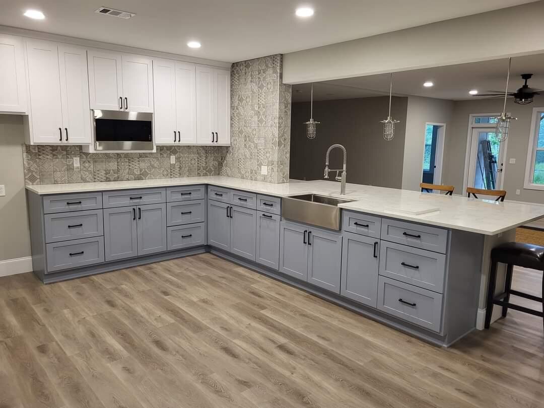A custom gray shaker kitchen with an island, built by RB & L