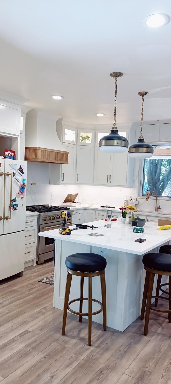 White custom kitchen with an island and pendant lights